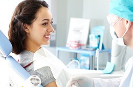 woman smiling softly at dentist