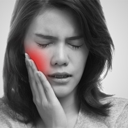 Woman experiencing tooth pain 