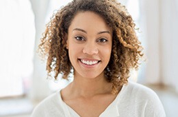 woman smiling in white