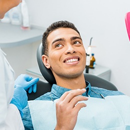 young man talking to his dentist