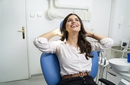 Smiling woman relaxing after sedation dentistry in Concord 