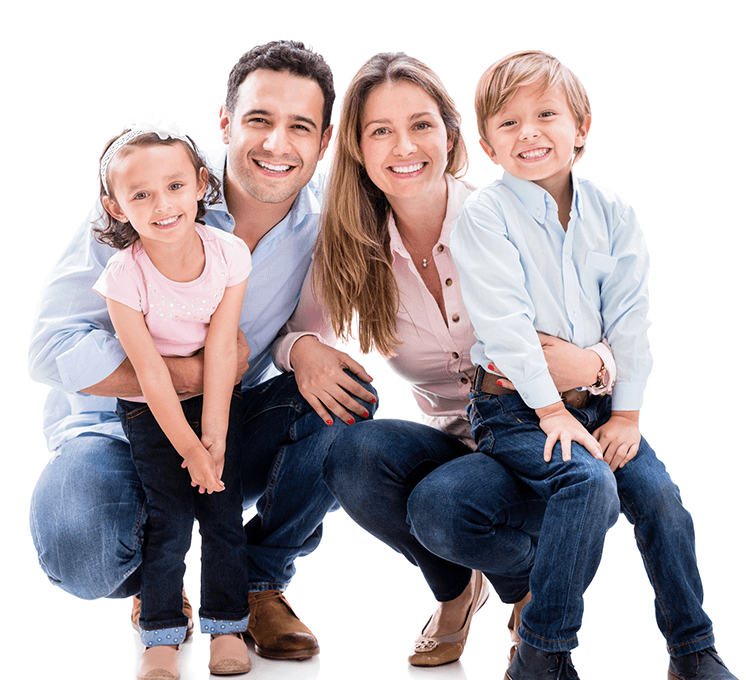 Family of four smiling brightly