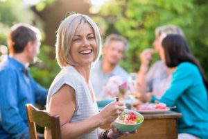 person enjoying a dinner with friends