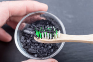 powdered activated charcoal on toothbrush