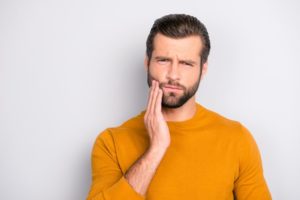 frowning man needs to visit periodontal dentist in Concord