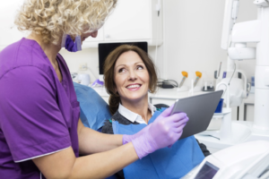 a patient attending their dental implant consultation 